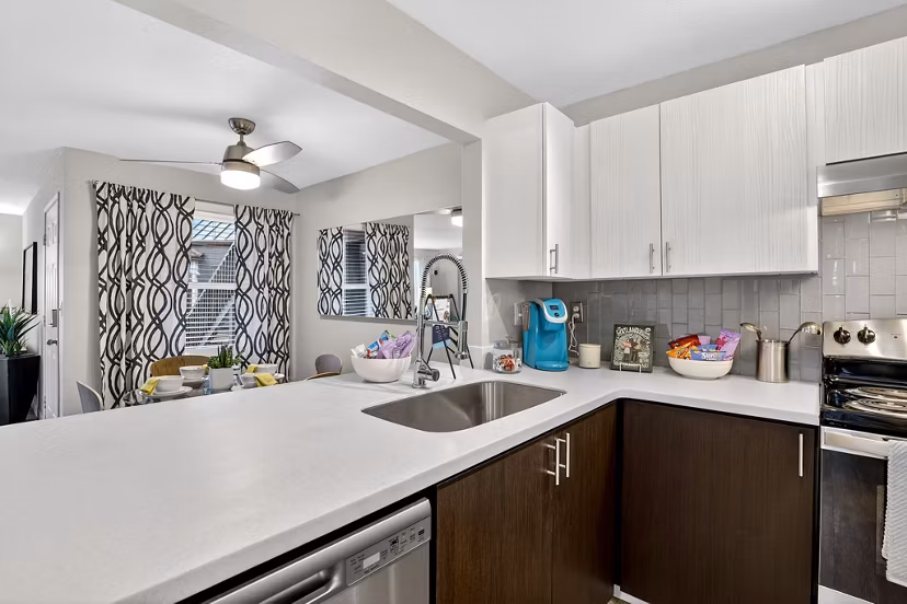 Modern kitchen with stainless steel appliances at Rivercrest Meadows Apartments
