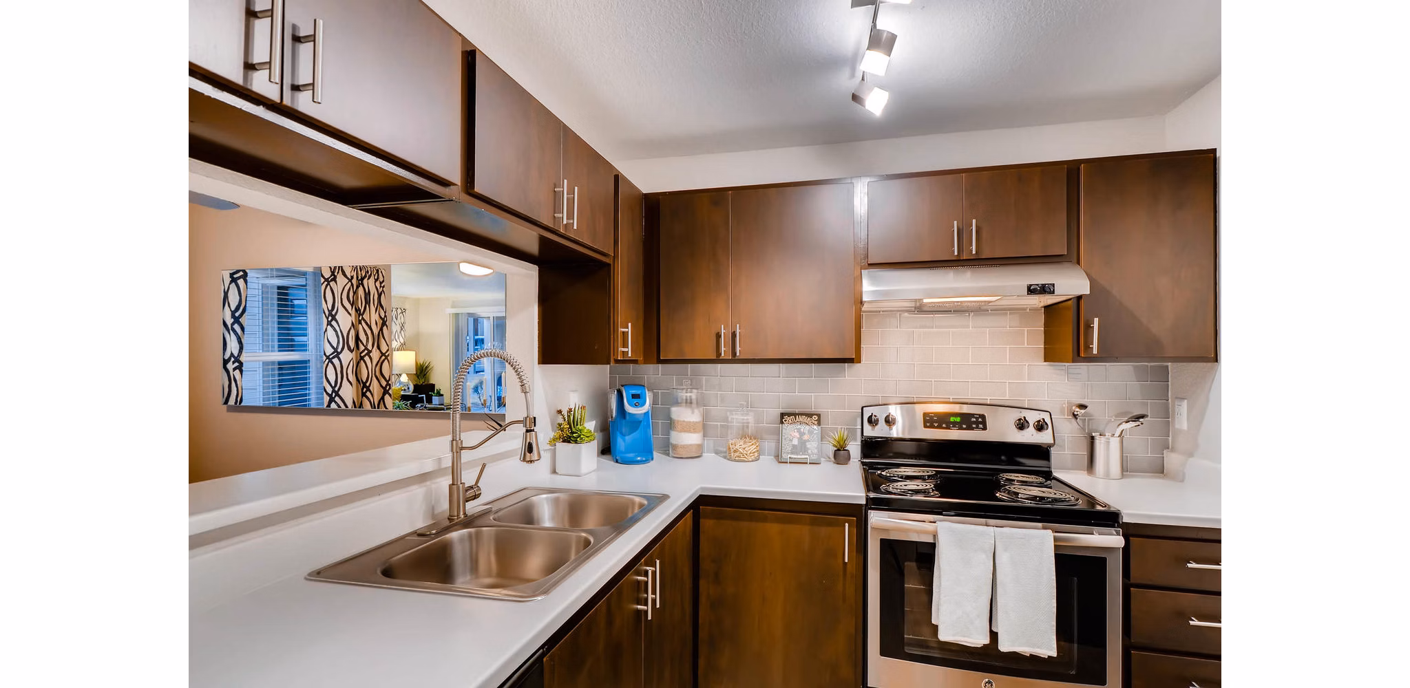 Modern kitchen with stainless steel appliances at Rivercrest Meadows Apartments