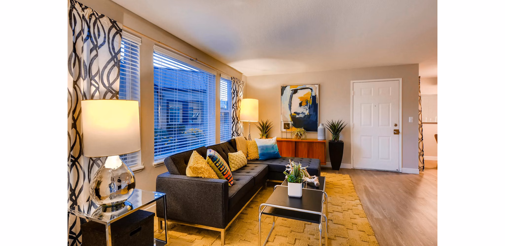 Spacious living room with modern furnishings in Rivercrest Meadows Apartments