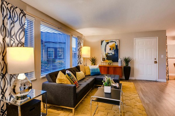 Spacious living room with modern furnishings in Rivercrest Meadows Apartments