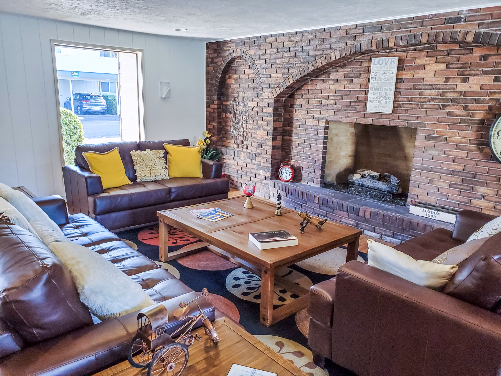 Modern clubhouse with leisure seating and entertainment area at Meadowlawn Apartments