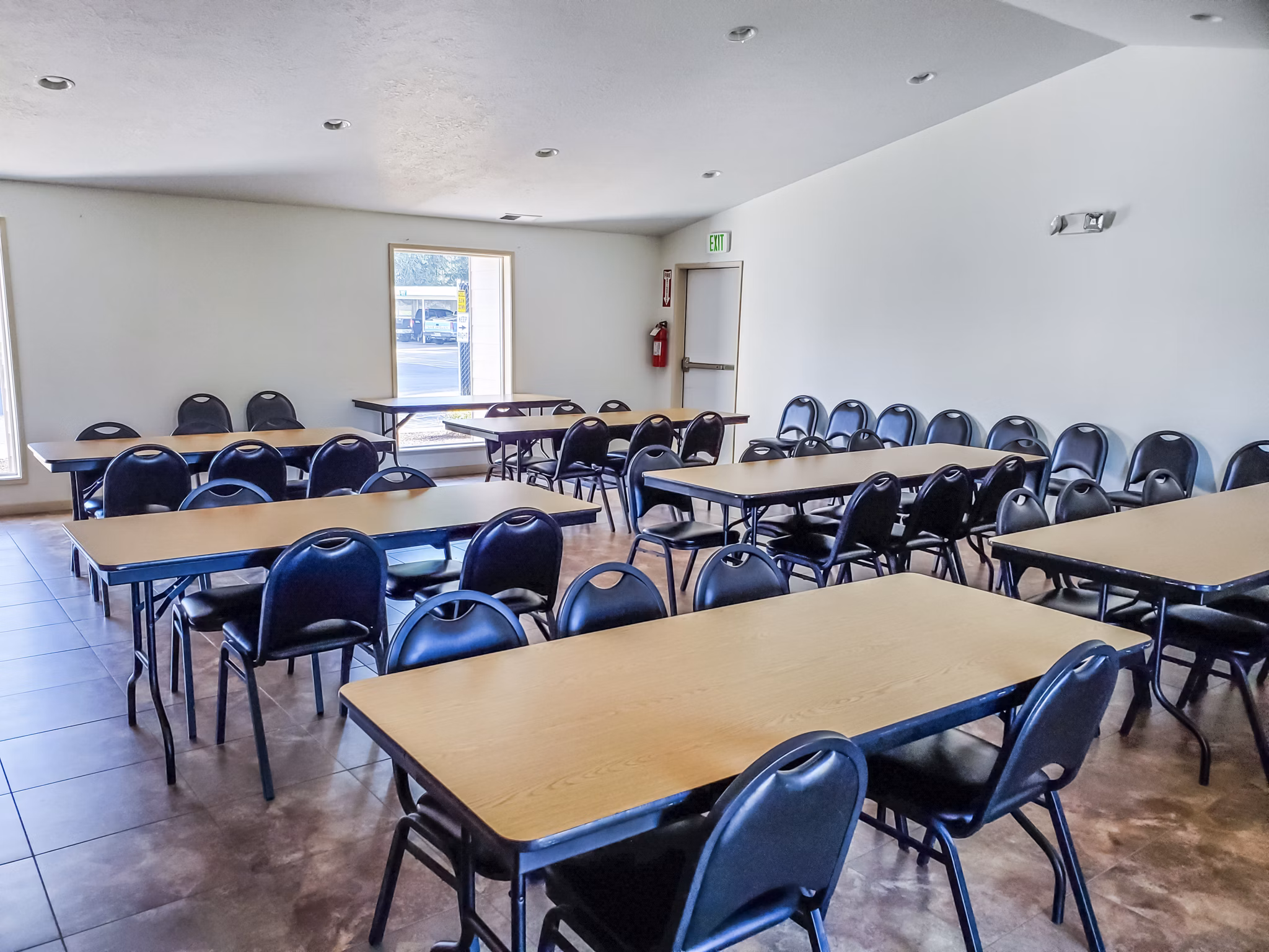 Clubhouse dining room with elegant seating and decor at Meadowlawn Apartments