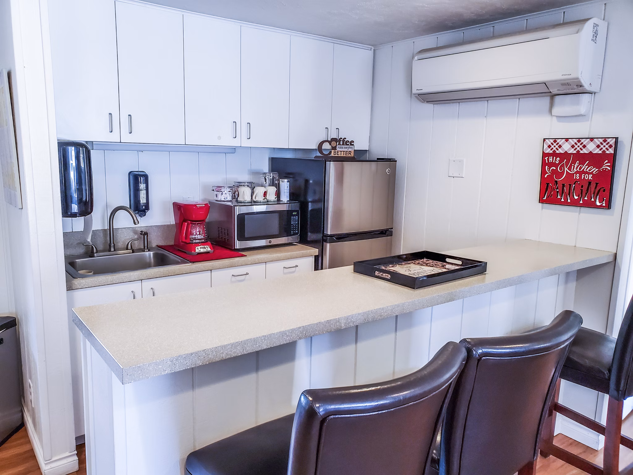 Clubhouse kitchen with modern appliances at Meadowlawn Apartments, offering luxury amenities for residents to enjoy