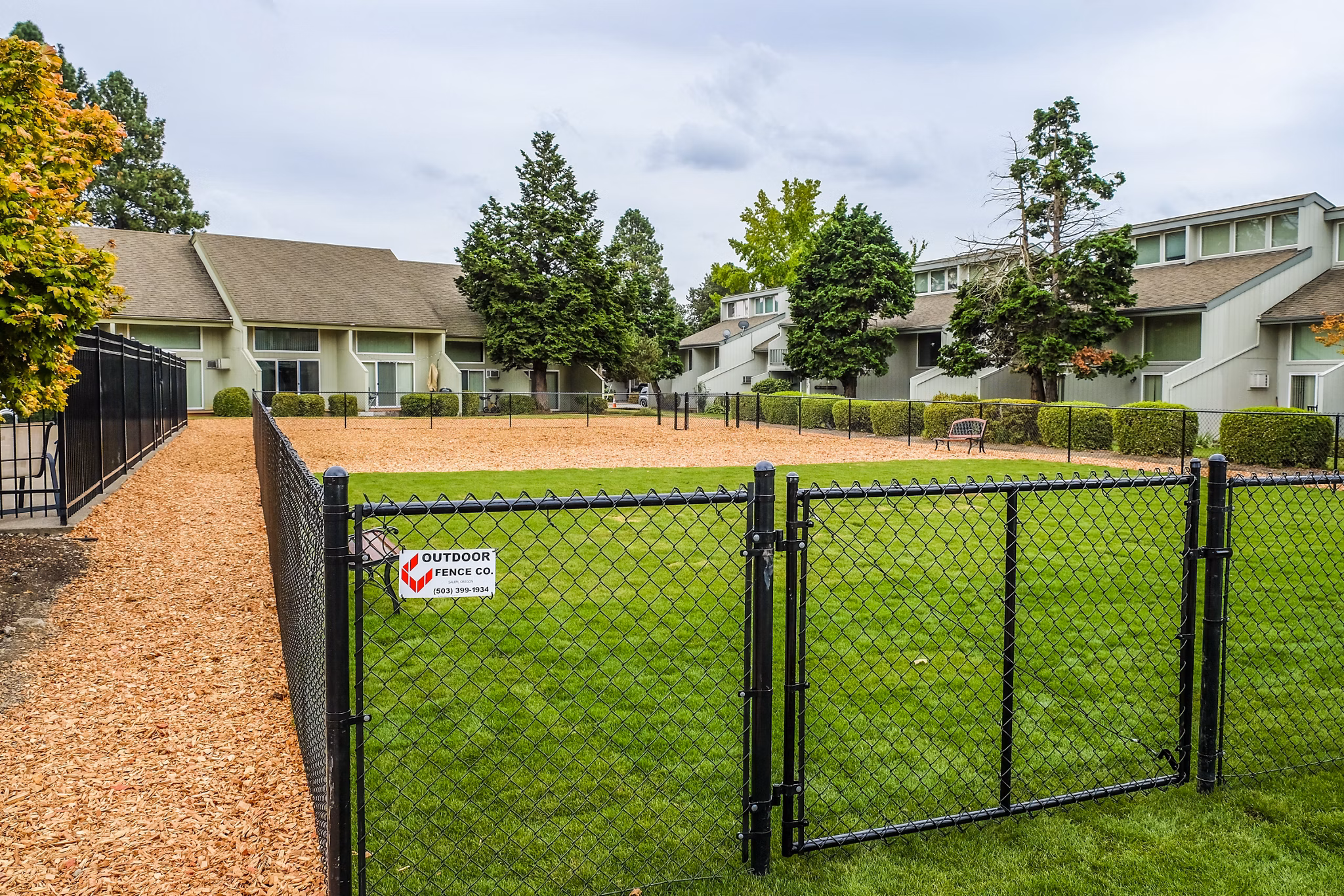 Dog park with agility equipment at Meadowlawn Apartments, a pet-friendly community