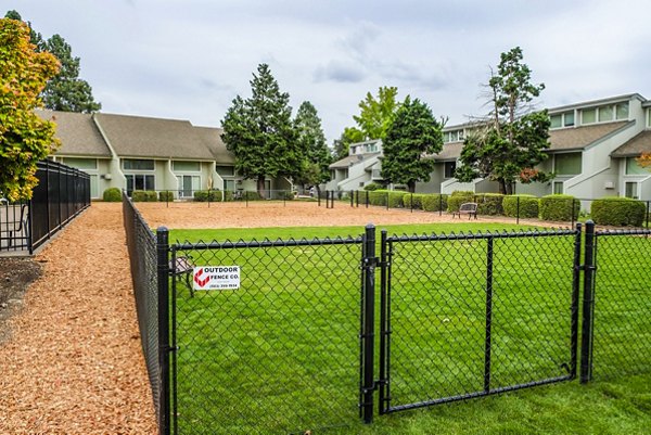 Dog park with agility equipment at Meadowlawn Apartments, a pet-friendly community