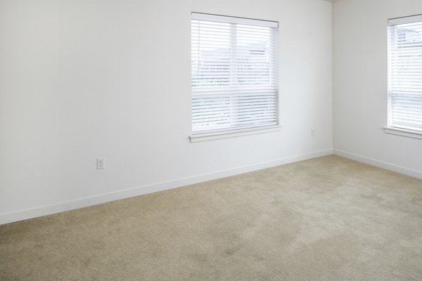 Cozy bedroom with modern decor at The Felix Apartments, offering luxury living in a prime location Ideal for stylish and comfortable home seekers