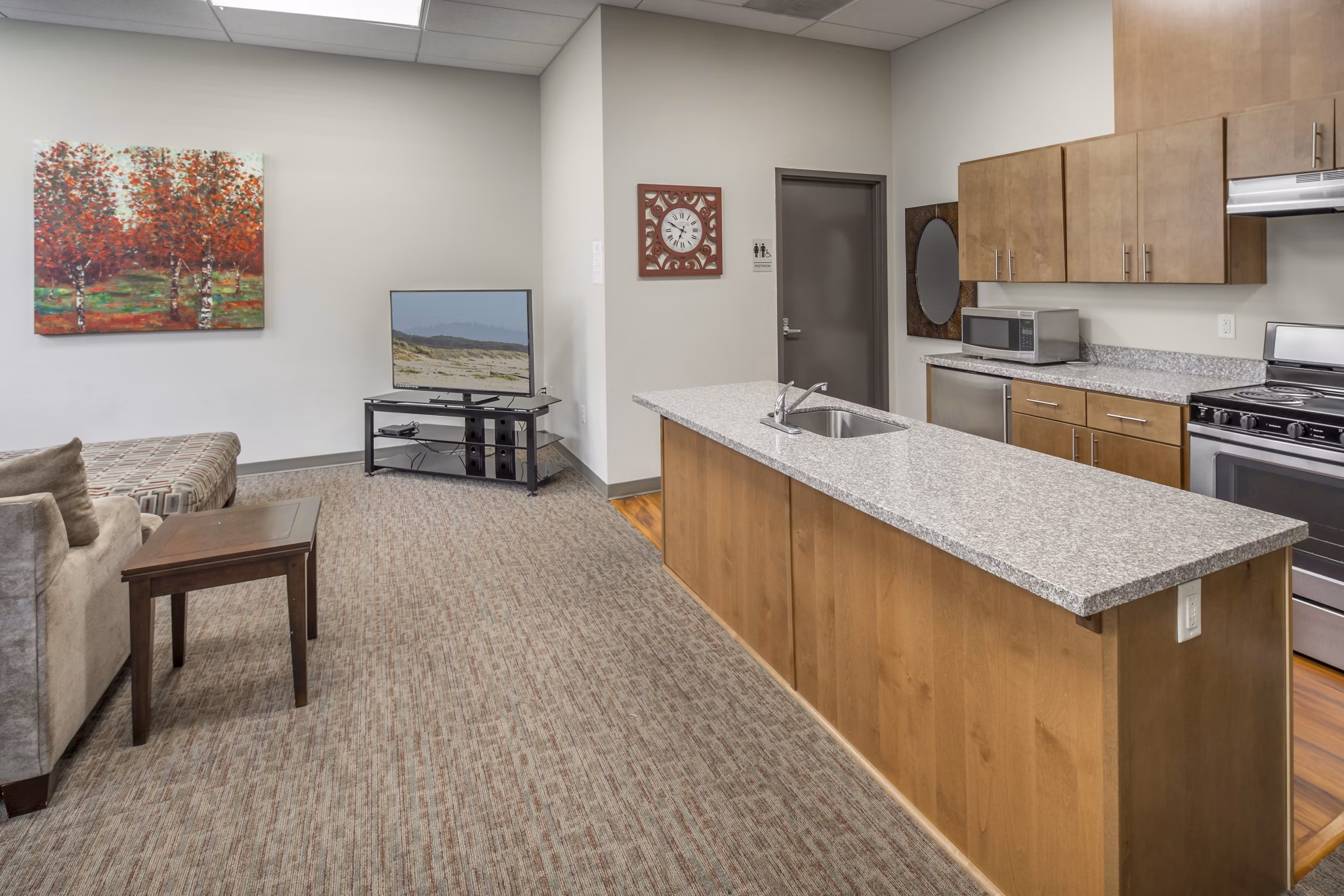 Clubhouse featuring modern decor and ample seating at The Felix Apartments