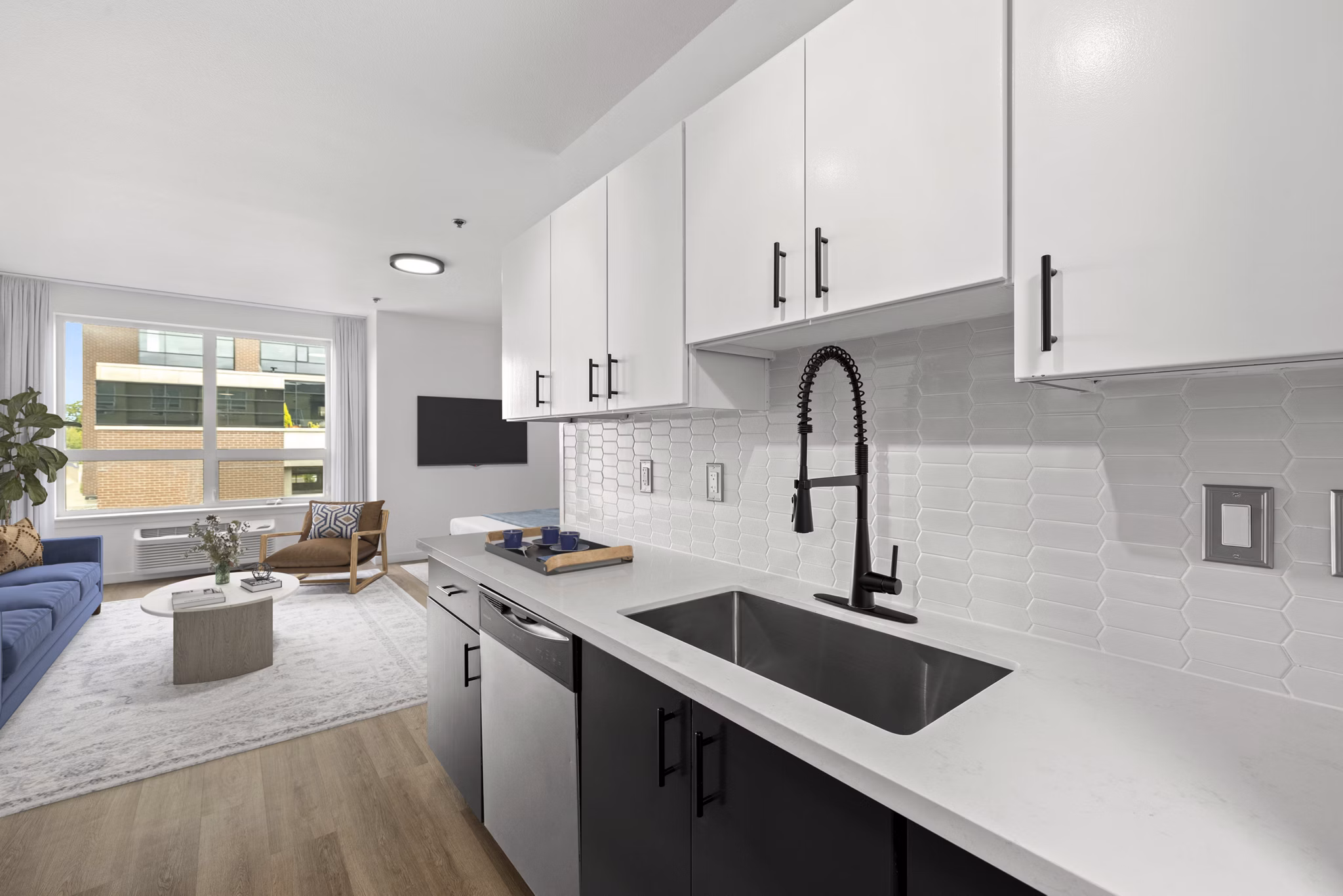Modern kitchen with stainless steel appliances at The Felix Apartments