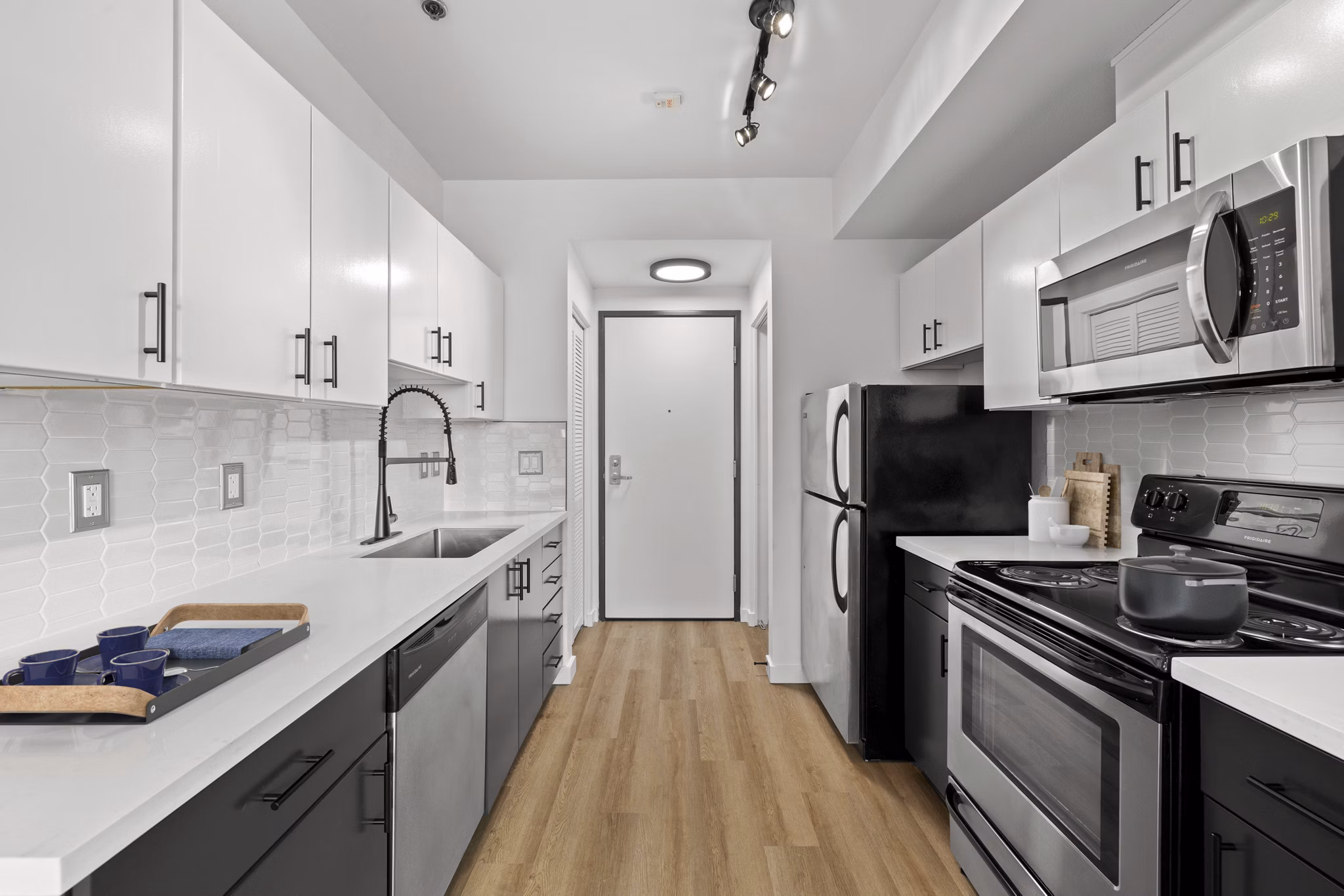 The Felix Apartments: Modern kitchen with stainless steel appliances and granite countertops