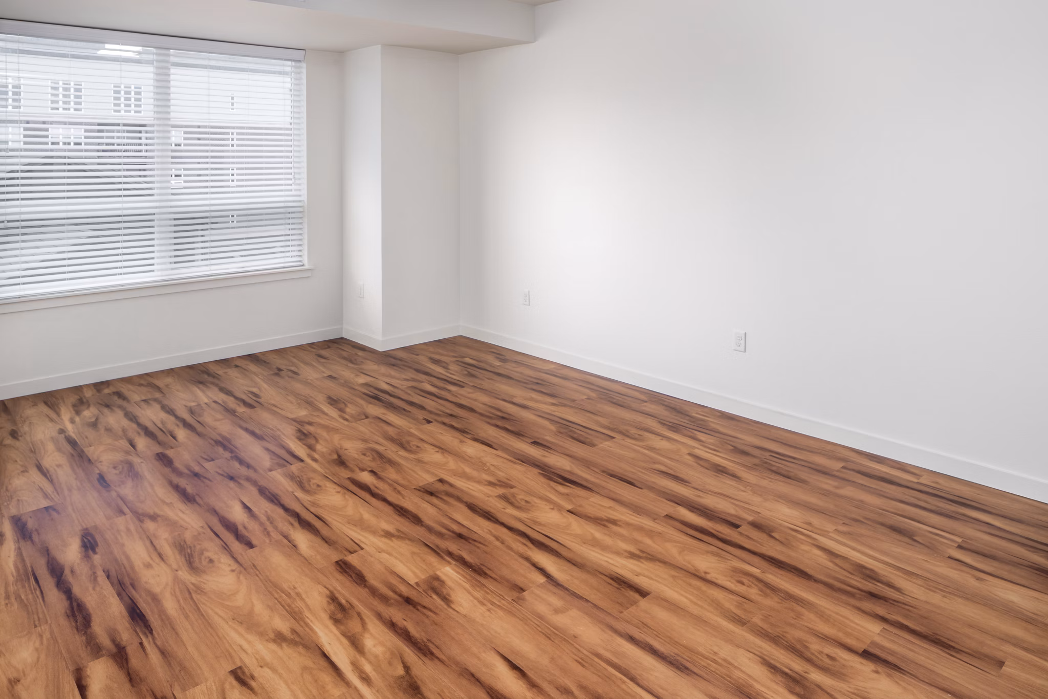 Spacious living room with modern decor at The Felix Apartments, a luxury residence by Greystar