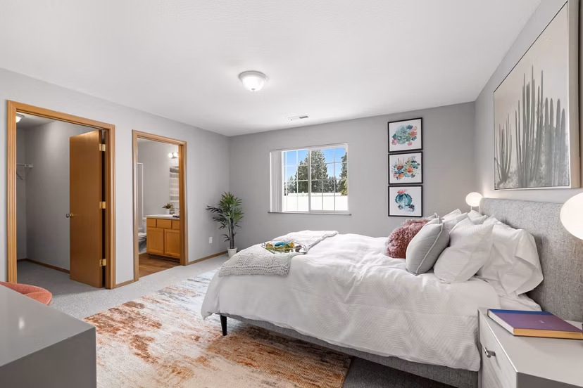 Cozy bedroom with modern furnishings at Highland Hills Apartments