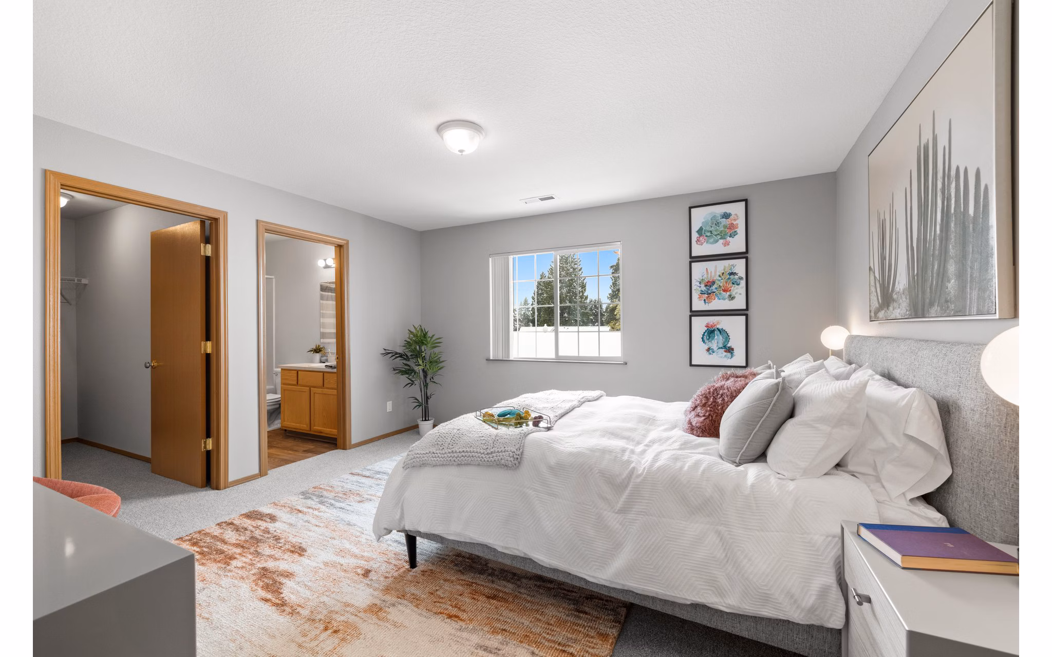 Cozy bedroom with modern furnishings at Highland Hills Apartments
