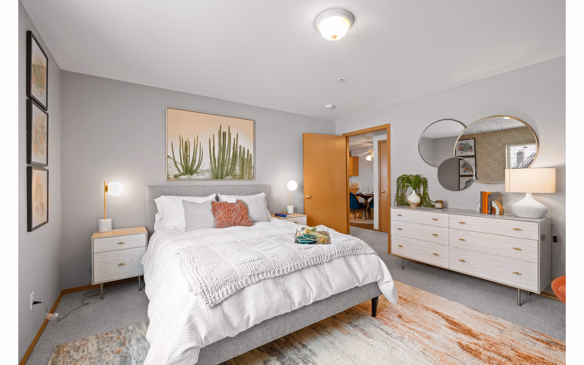 Bedroom with cozy decor and elegant furniture in Highland Hills Apartments