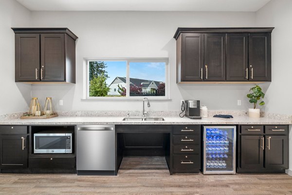 Clubhouse featuring modern design and cozy seating at Highland Hills Apartments