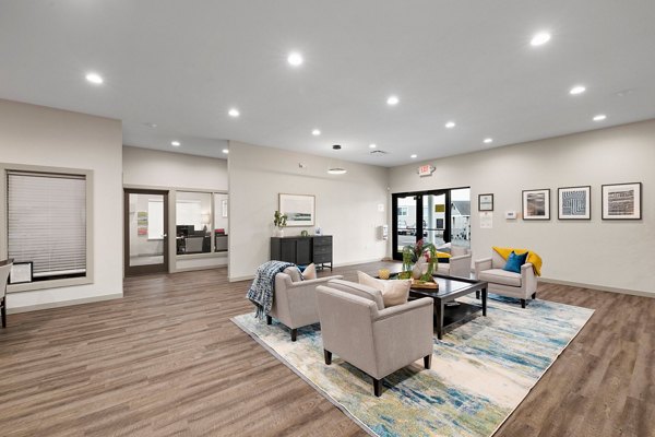 Elegant clubhouse with cozy seating and modern decor at Highland Hills Apartments