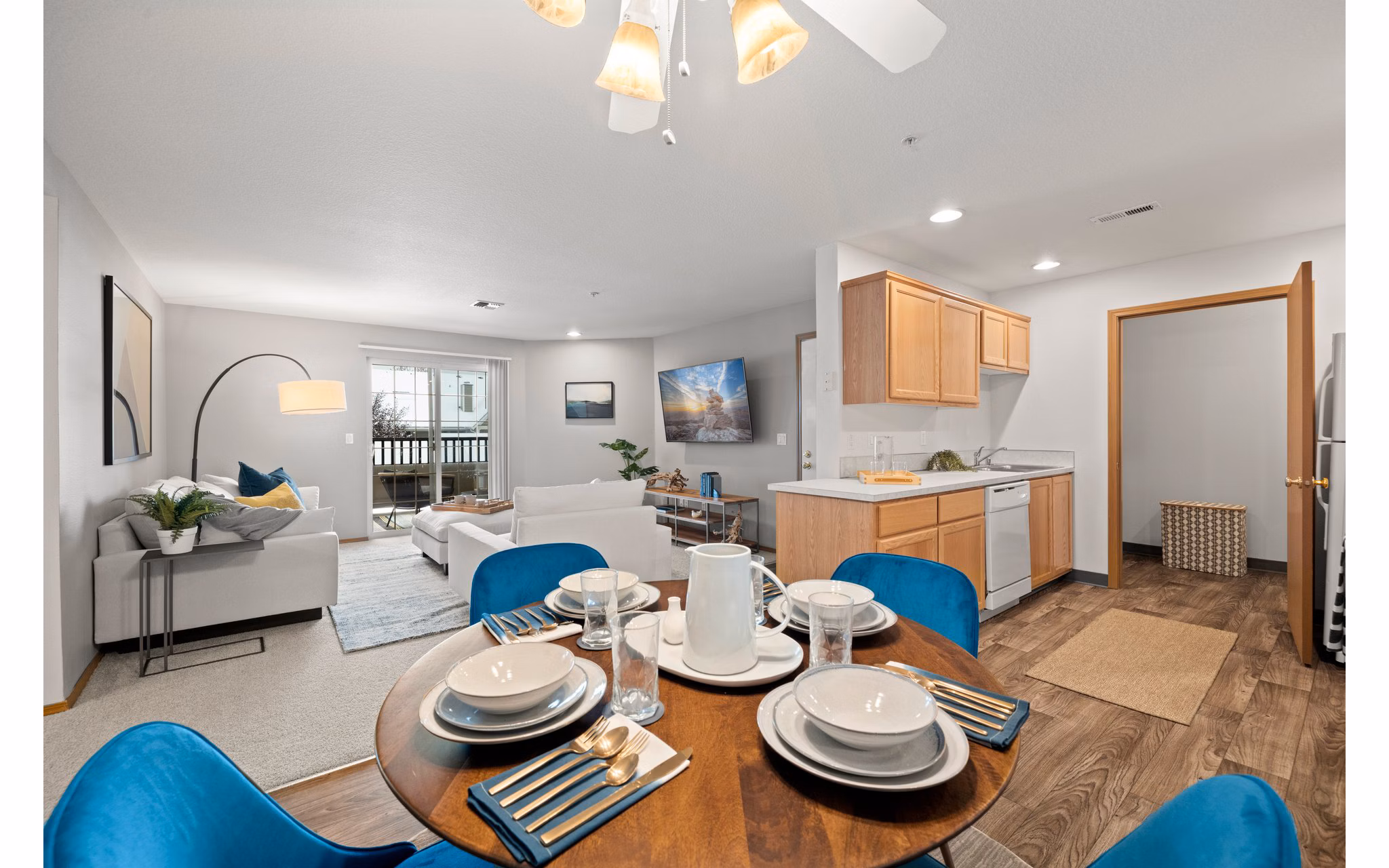 Dining area with sleek furnishings and ample lighting at Highland Hills Apartments