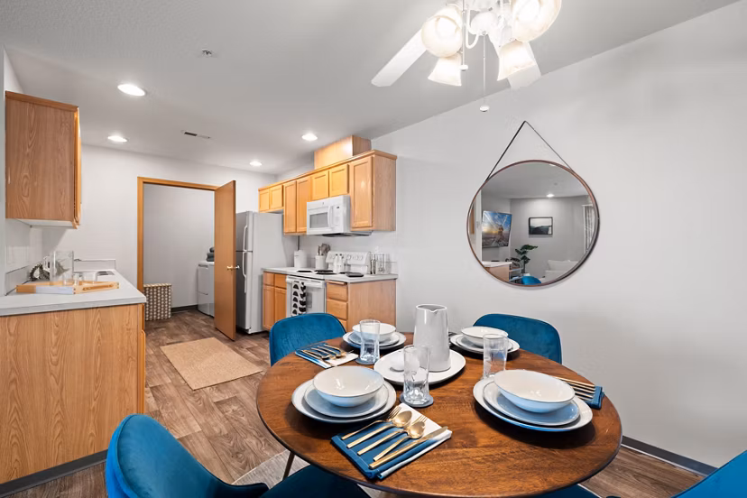 Dining area featuring modern decor and elegant lighting at Highland Hills Apartments