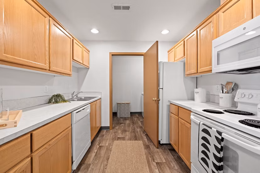 Modern kitchen with stainless steel appliances at Highland Hills Apartments
