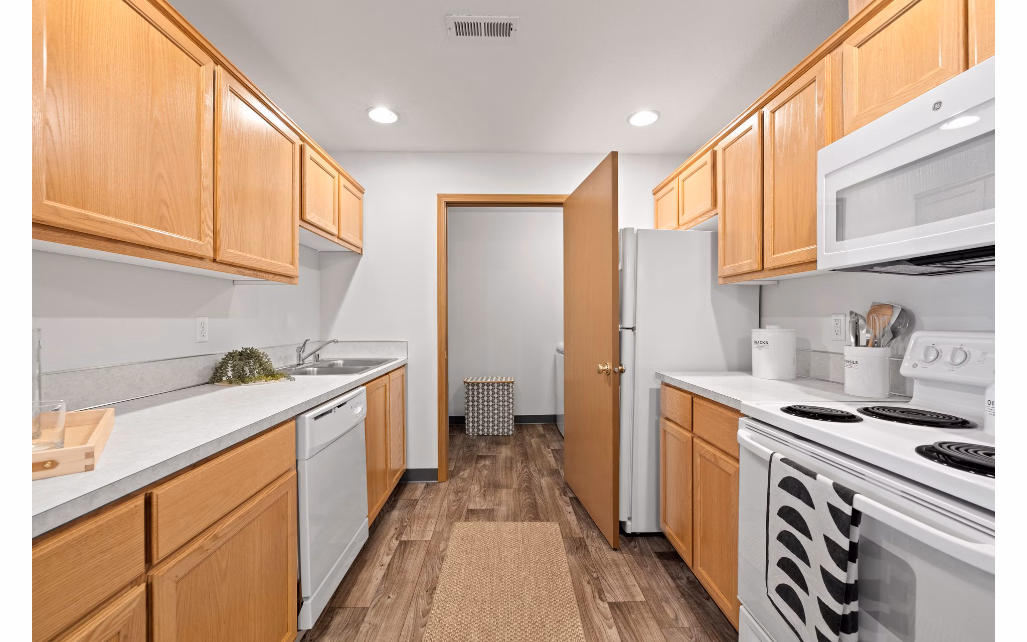 Modern kitchen with stainless steel appliances at Highland Hills Apartments