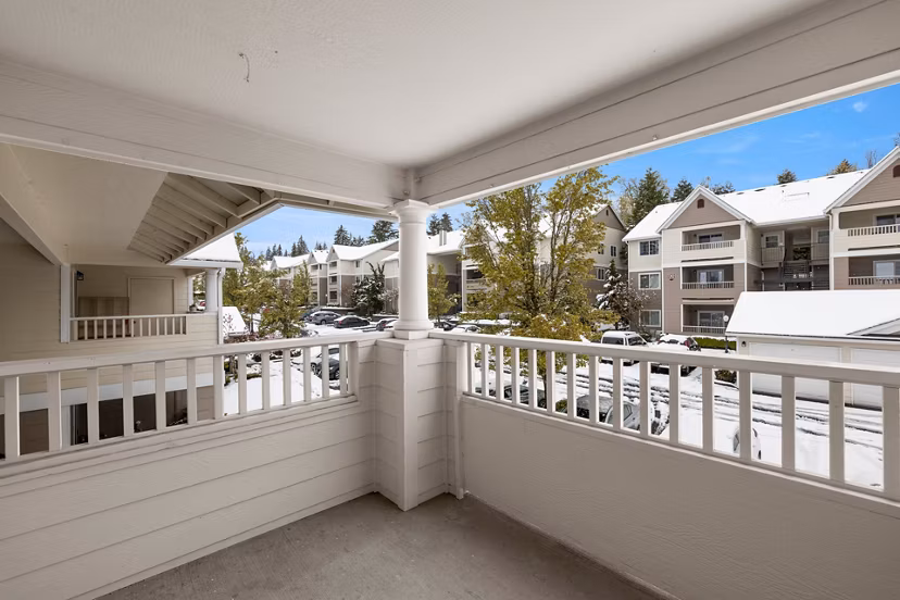 Cozy patio with greenery at Highland Hills Apartments, an upscale feature for relaxation and outdoor enjoyment in elegant surroundings