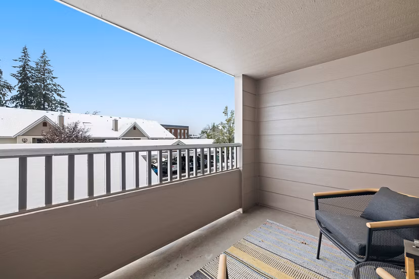 Spacious patio with outdoor seating at Highland Hills Apartments, perfect for relaxation and gatherings