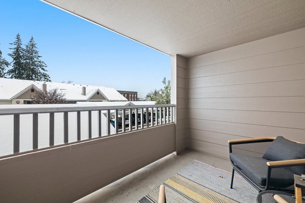 Spacious patio with outdoor seating at Highland Hills Apartments, perfect for relaxation and gatherings