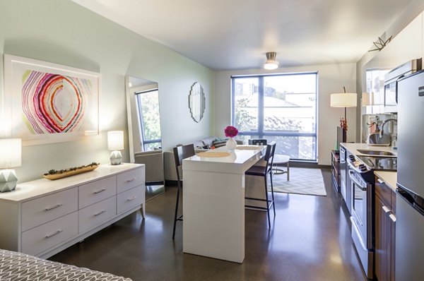 The Addy Apartments: Luxurious bedroom with modern decor and ample space
