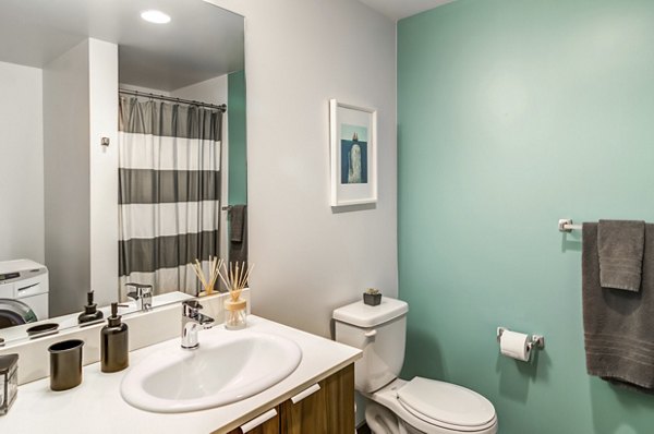 The Addy: Modern bathroom with sleek fixtures in luxury apartments