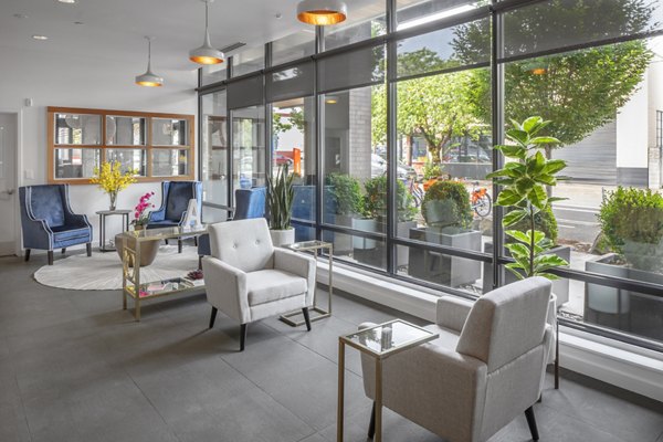 Modern clubhouse featuring stylish seating and decor at The Addy Apartments, a luxury living community in the heart of the city