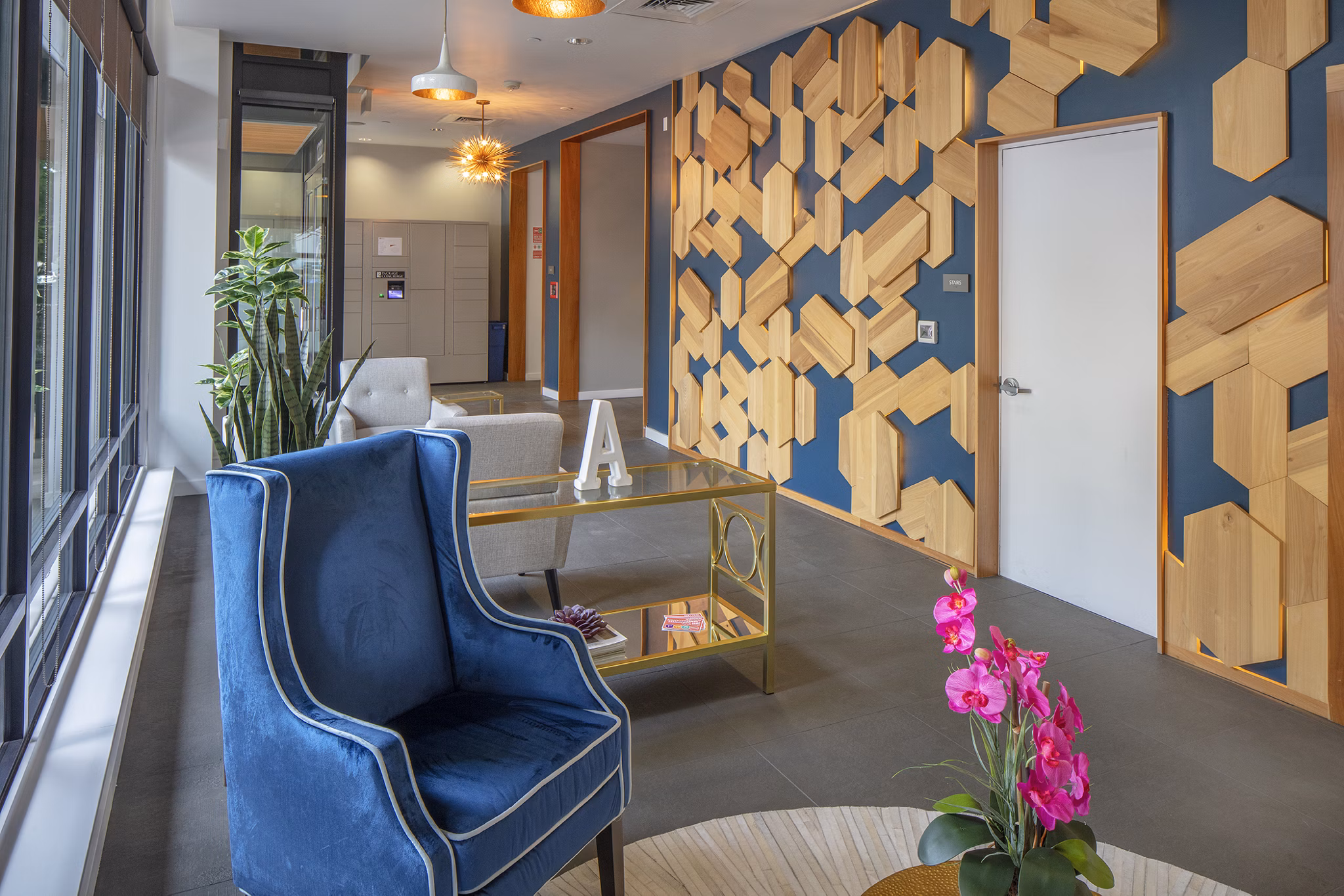 Clubhouse featuring modern design and comfy seating at The Addy Apartments, a luxury Greystar community