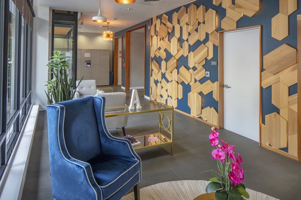 Clubhouse featuring modern design and comfy seating at The Addy Apartments, a luxury Greystar community