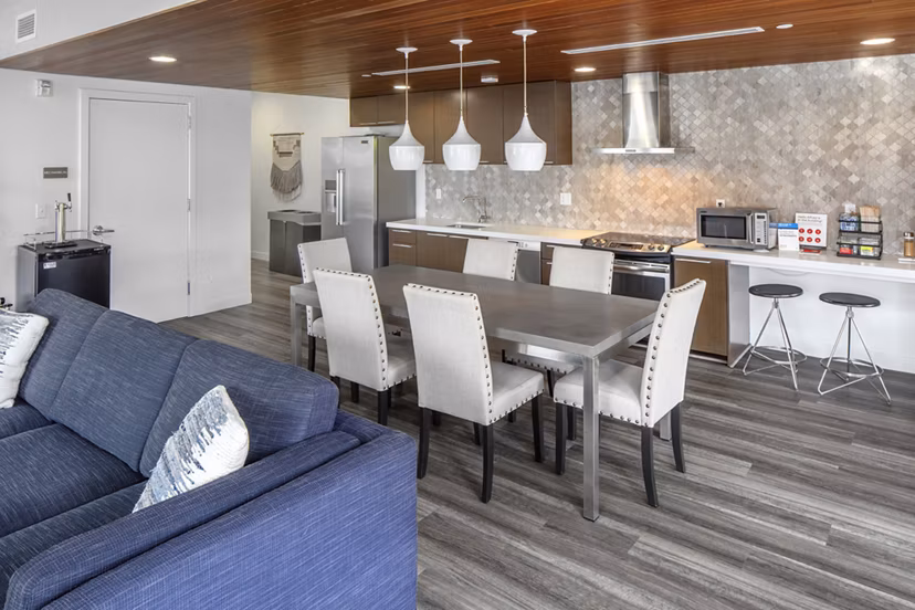 Modern clubhouse with stylish seating and billiards table at The Addy Apartments