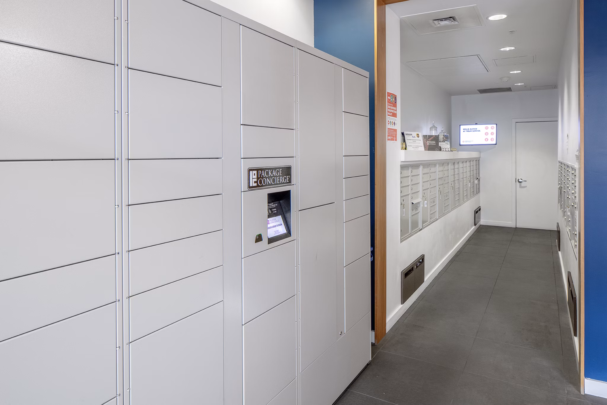 Mailroom with organized packages at The Addy Apartments