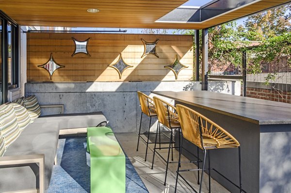 The Addy: Modern outdoor patio space with stylish seating and greenery at luxury apartments in vibrant neighborhood