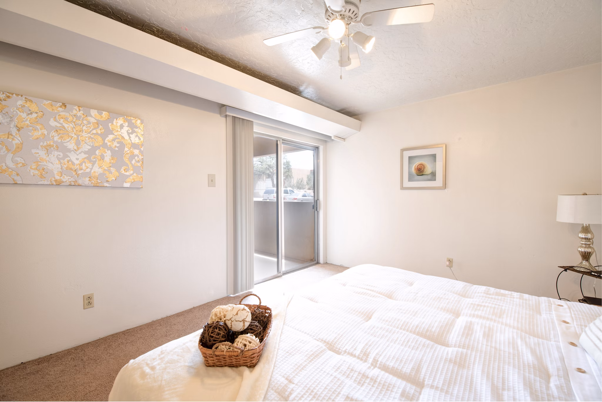Cozy bedroom featuring modern decor and ample natural light at Desert Creek Apartments