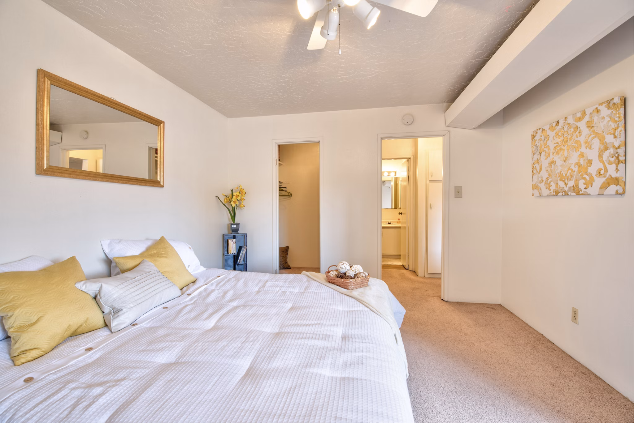 Contemporary bedroom with elegant furnishings in Desert Creek Apartments