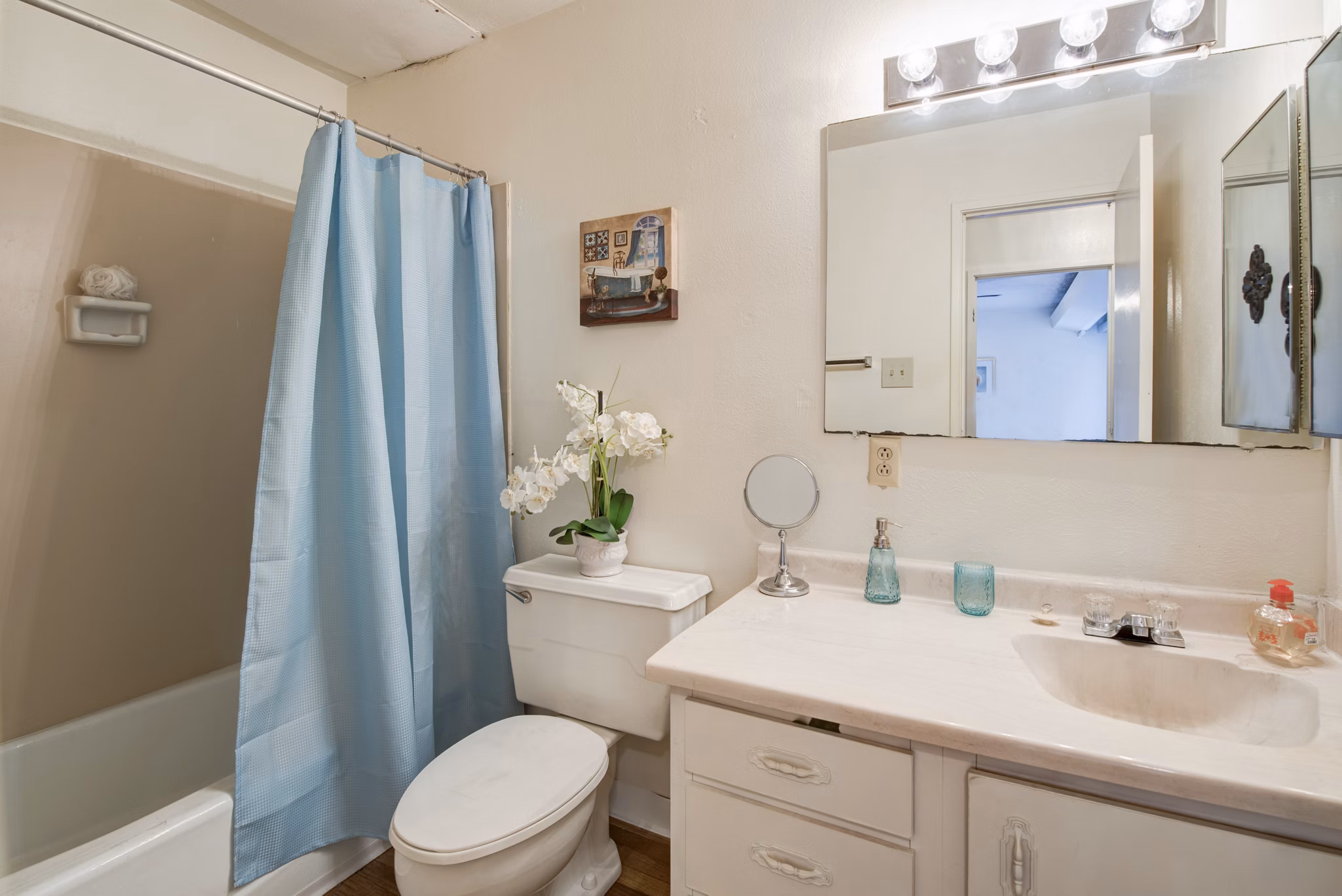 Compact bathroom with modern fixtures at Desert Creek Apartments