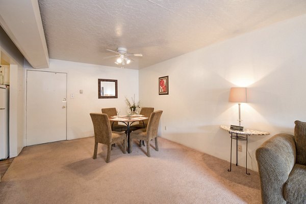 Dining room featuring elegant furnishings and contemporary decor at Desert Creek Apartments in a luxurious setting