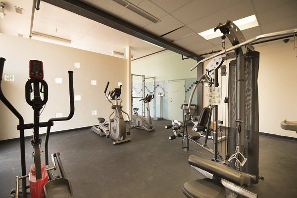 State-of-the-art fitness center at Desert Creek Apartments with modern equipment and spacious workout areas for residents