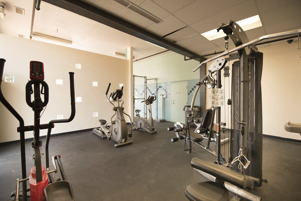 State-of-the-art fitness center at Desert Creek Apartments with modern equipment and spacious workout areas for residents