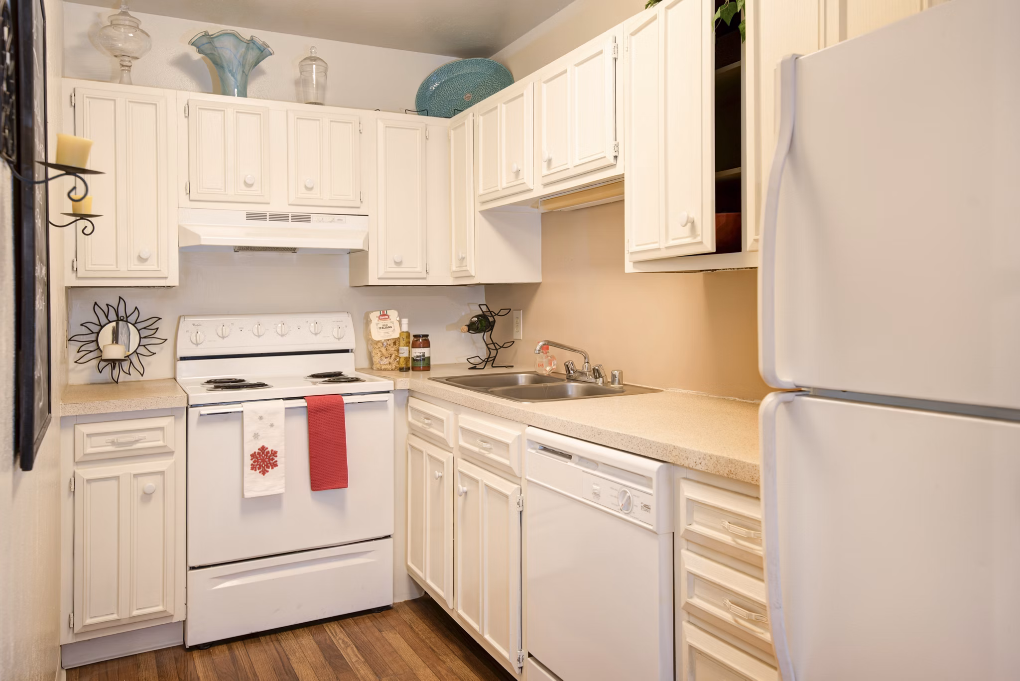 Kitchen featuring modern stainless steel appliances at Desert Creek Apartments