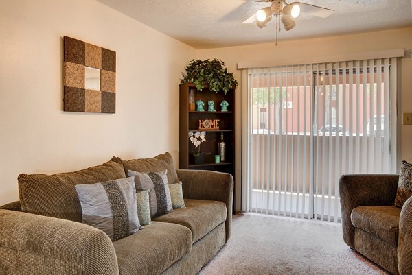 Spacious living room with modern furnishings at Desert Creek Apartments, providing luxury apartment living for residents