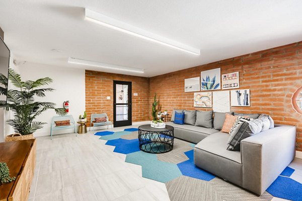 Clubhouse with modern design elements and cozy seating areas at Genoa Lakes Apartments, a luxury community by Greystar