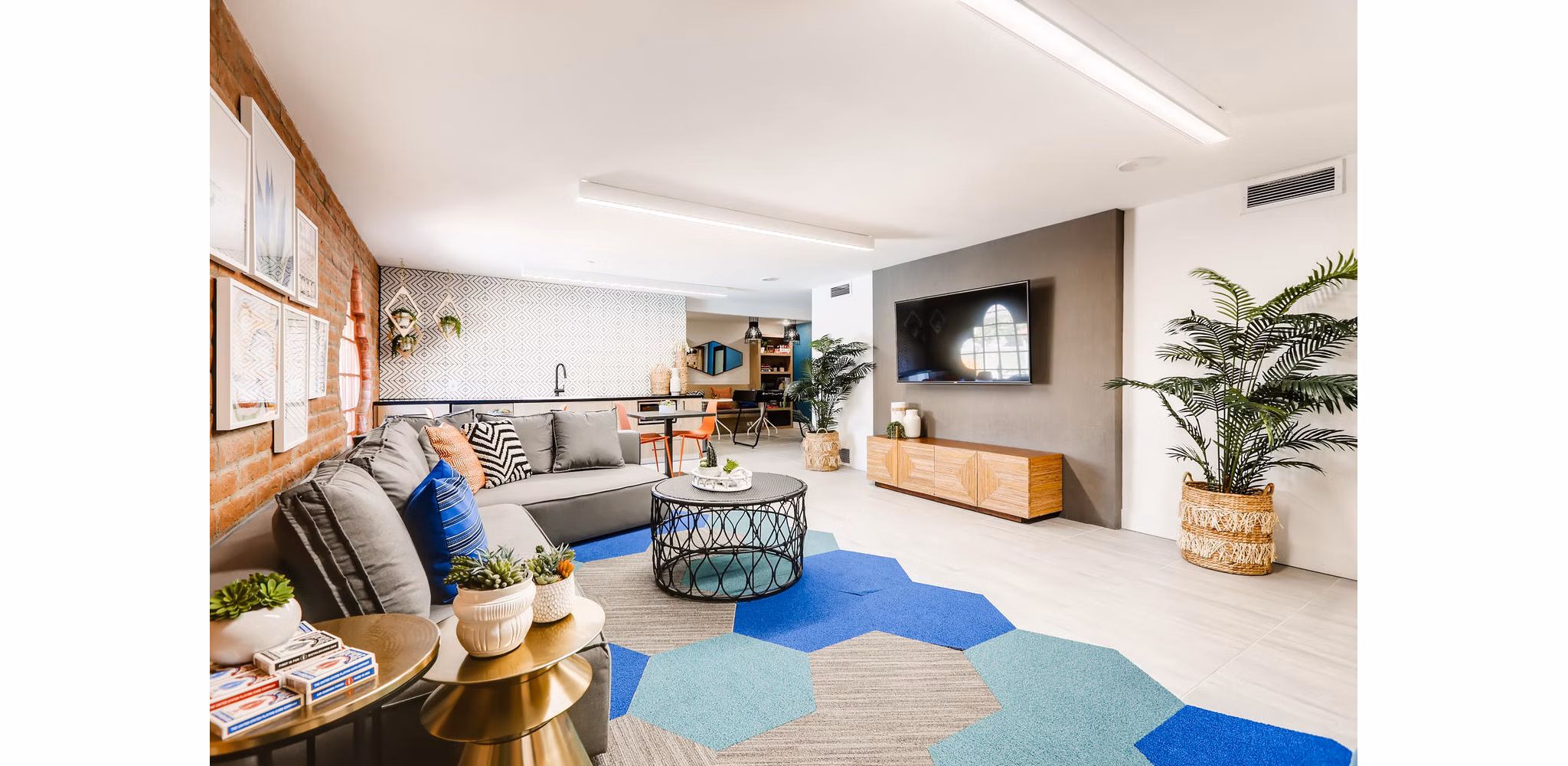 Genoa Lakes Apartments: Modern clubhouse with luxury seating and gaming areas, ideal for socializing and relaxation
