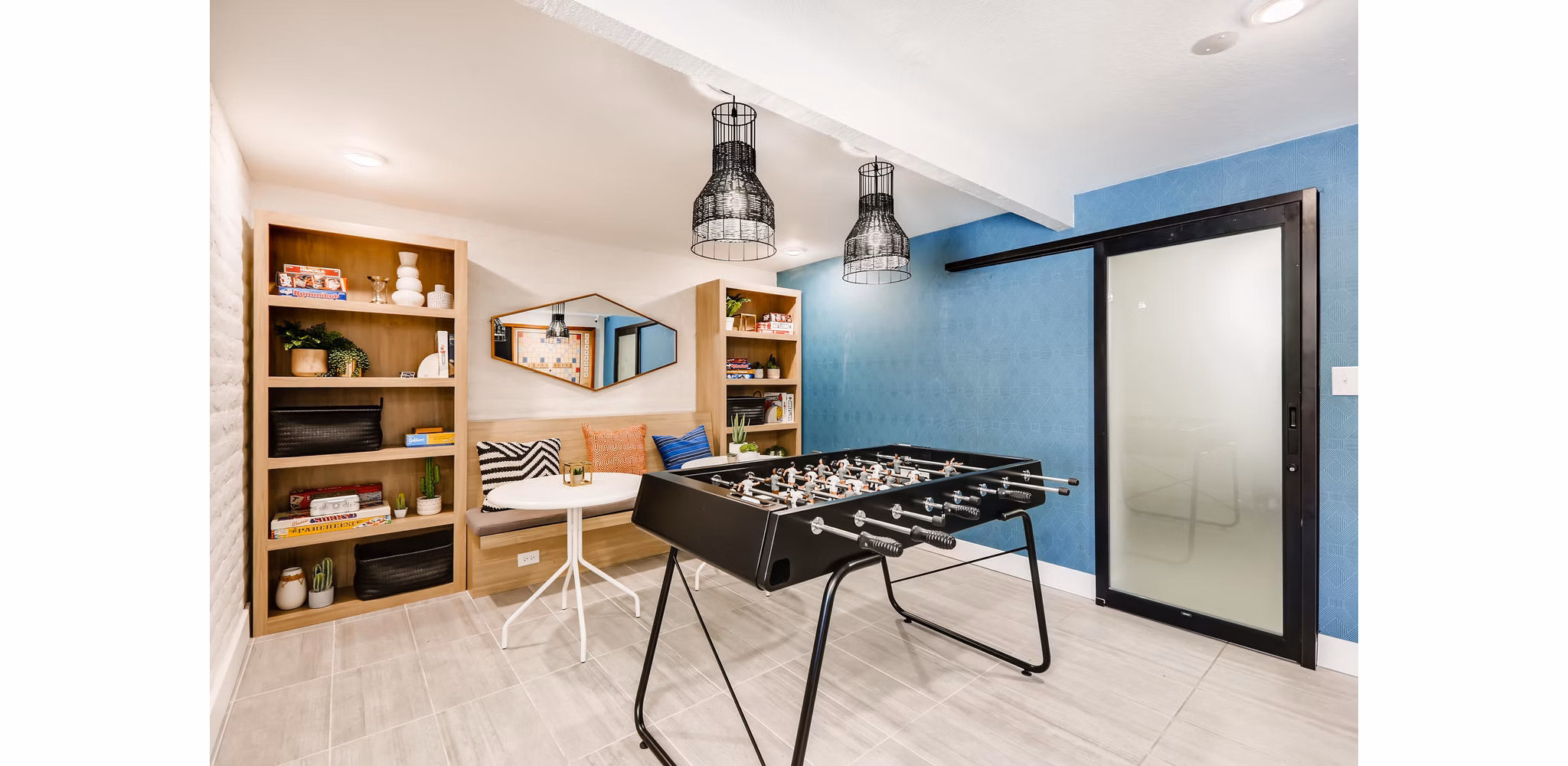 Entertaining game room with billiards and seating area at Genoa Lakes Apartments
