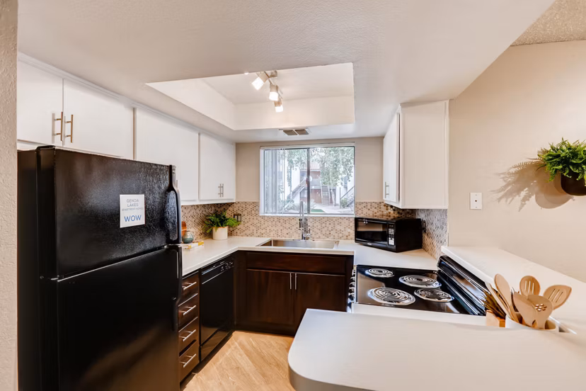 Modern kitchen with stainless steel appliances at Genoa Lakes Apartments