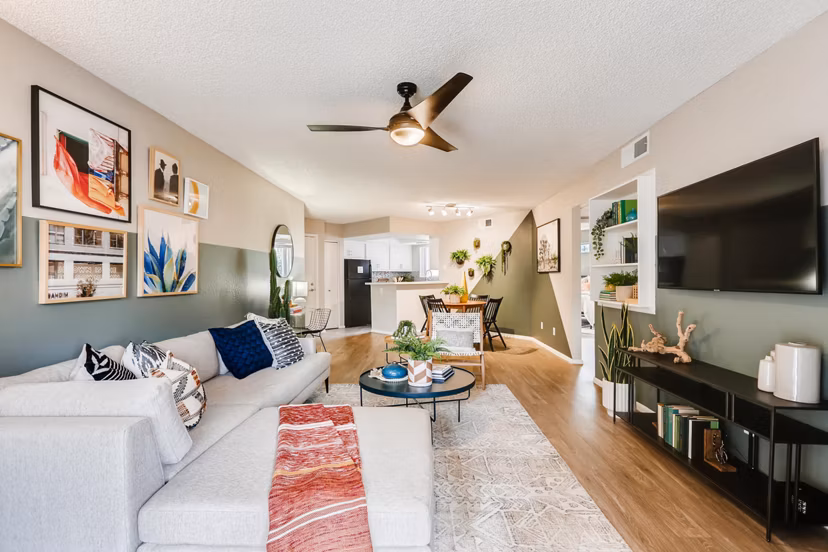 Spacious living room with modern decor at Genoa Lakes Apartments