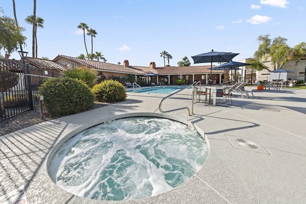Hot tub with jacuzzi jets at 1000 Genoa Lakes Apartments offering serene relaxation spots for residents
