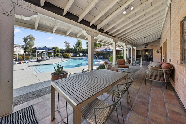 Spacious outdoor patio with modern seating at 1000 Genoa Lakes Apartments