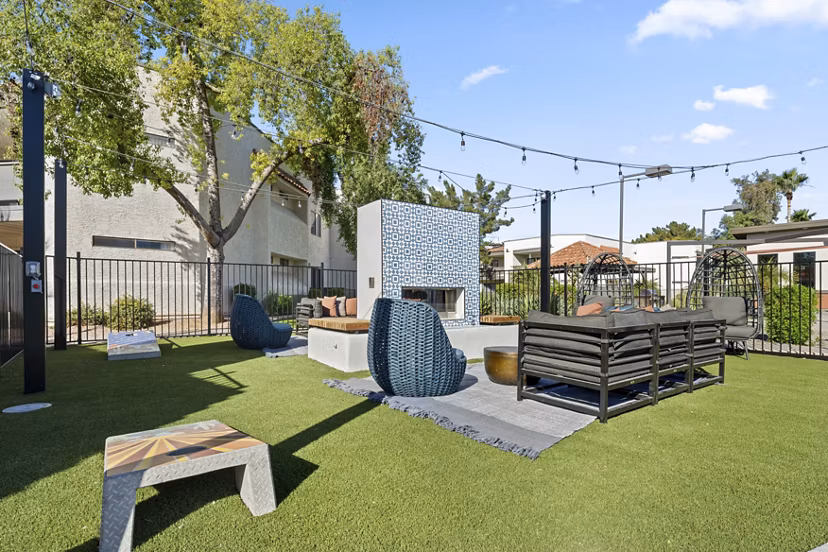 Cozy outdoor fire pit area at 1000 Genoa Lakes Apartments, perfect for social gatherings and relaxation